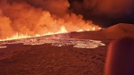 Billowing smoke and flowing lava turning the sky orange are seen in this Icelandic Department of Civil Protection and Emergency Management handout image during an volcanic eruption on the Reykjanes peninsula 3 km north of Grindavik, western Iceland on Dec