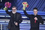 Italian singers Fedez (R) and Marco Masini (L) on stage at the Ariston theatre during the 76th edition of the Sanremo Italian Song Festival, in Sanremo, Italy, 24 February 2026. The music festival will run from 24 to 28 February 2026. ANSA/ETTORE FERRARI
