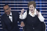 Sanremo Festival host and artistic director Carlo Conti (L) with The 105 year old Italian woman Gianna Pratesi (R) on stage at the Ariston theatre during the 76th edition of the Sanremo Italian Song Festival, in Sanremo, Italy, 24 February 2026. The music