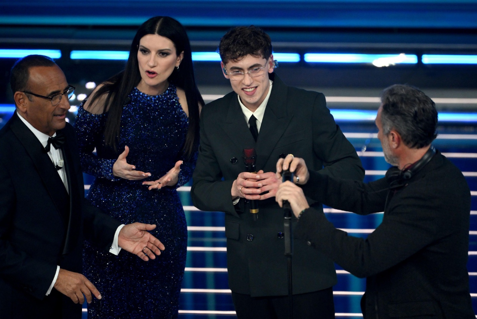 (L-R) Sanremo Festival host and artistic director Carlo Conti with Italian singer Laura Pausini and Italian singer Tredici Pietro on stage at the Ariston theatre during the 76th Sanremo Italian Song Festival, Sanremo, Italy, 24 February 2026. The Music Fe